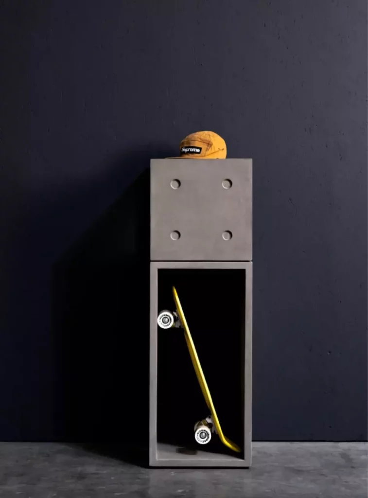 A trendy and practical concrete entrance cabinet to empty your pockets and store your skateboard made with 2 concrete modules Dice by Lyon béton