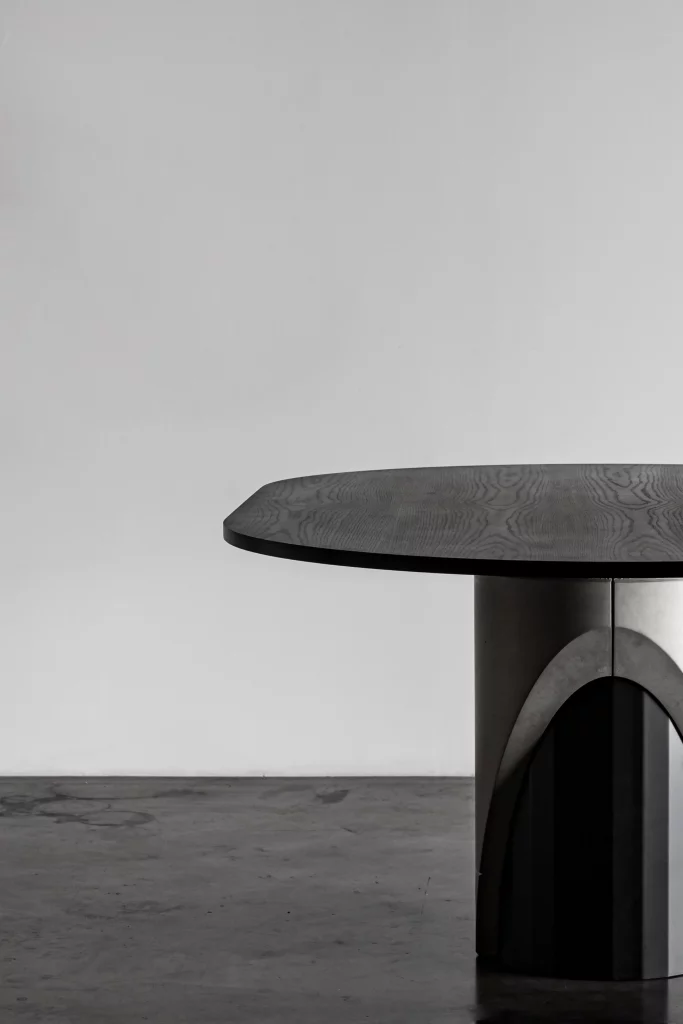 Detail of the wooden tinted matt black oak tabletop of the Sharp dining table by Bertrand Jayr