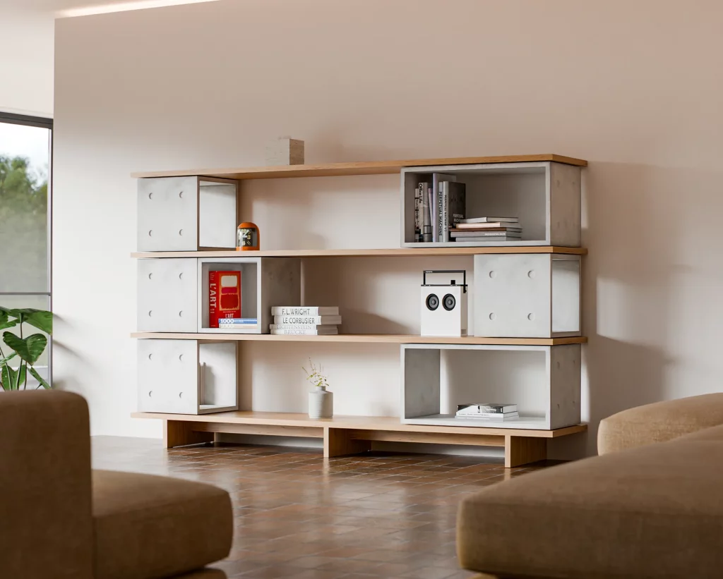 Bibliothèque composée de modules Dice en béton et d’étagères en chêne, avec des livres et une enceinte.