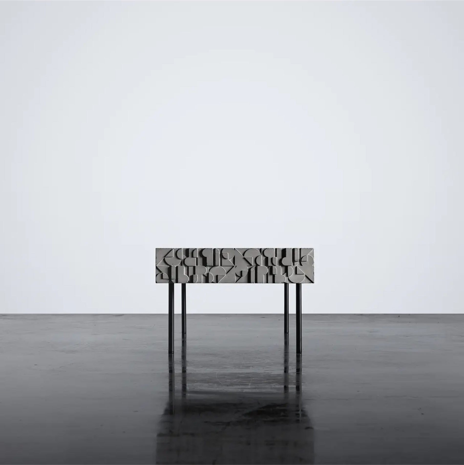 Concrete coffee table with art deco ornamentation by designer Bertrand Jayr