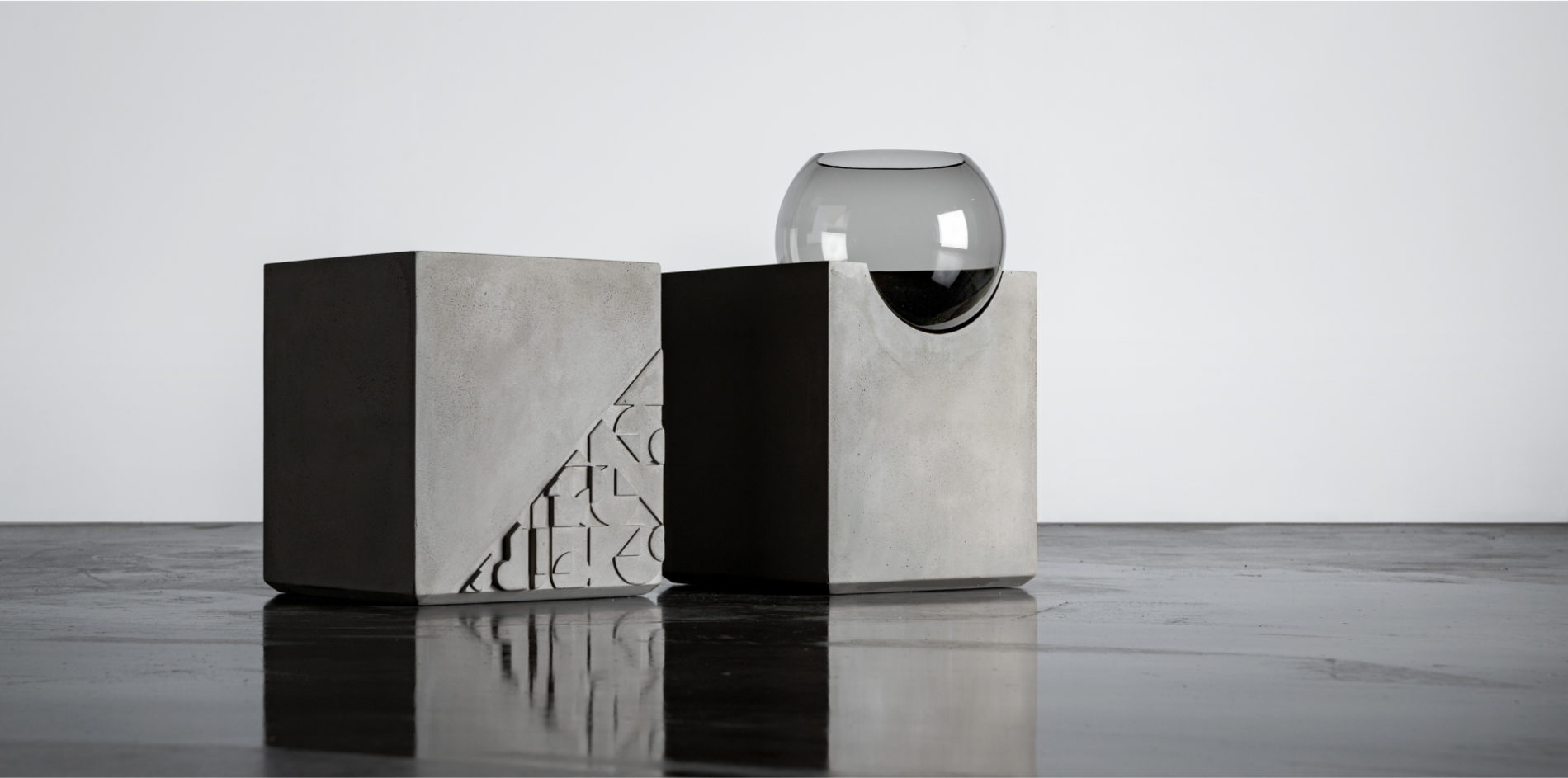 Concrete side table with glass globe