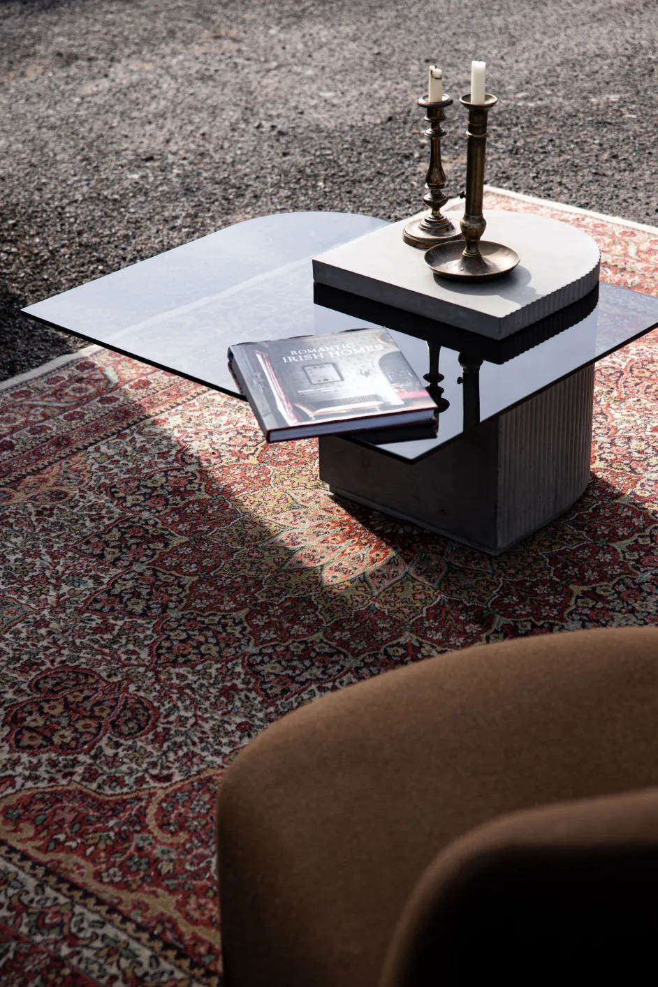 Concrete and hybrid glass cabinet between a coffee table and an extra table