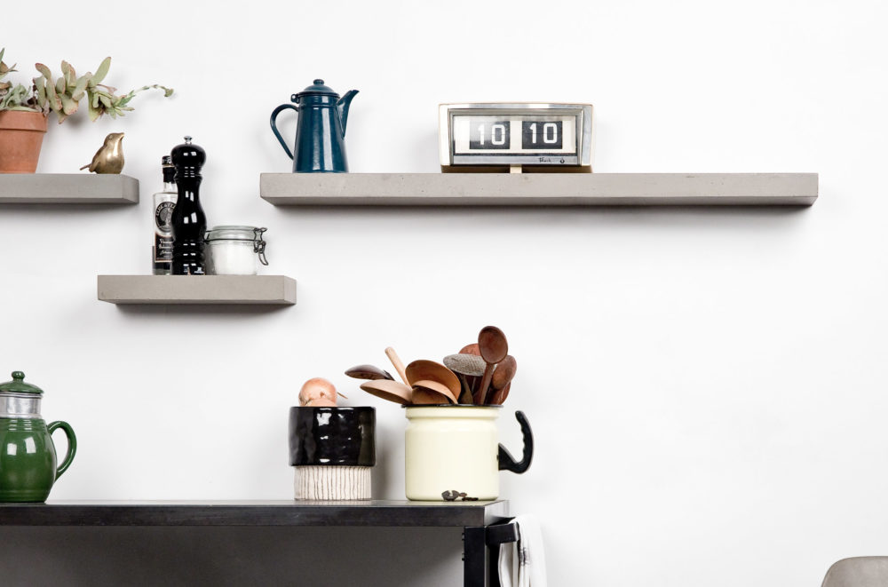 Sliced concrete storage composition above a kitchen cart