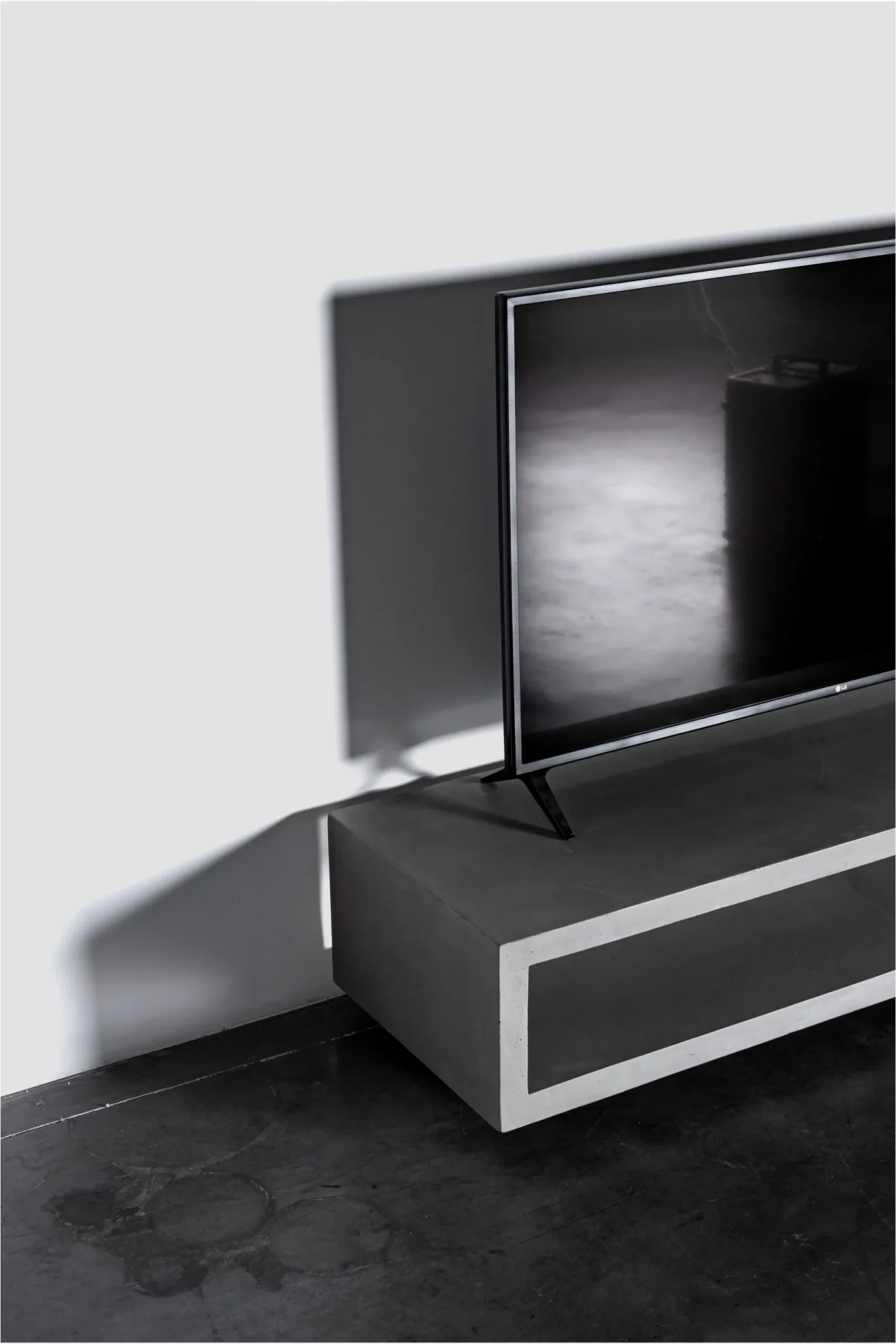 Monobloc concrete TV cabinets with TV